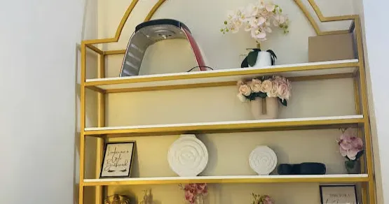 Gold shelving and décor — photo by Marshal Zulfa